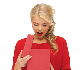 Image showing lovely woman in red dress with opened gift box