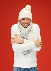 Image showing handsome man in warm sweater, hat and scarf