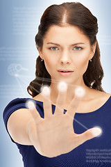 Image showing businesswoman working with touch screen