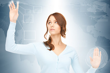 Image showing businesswoman working with touch screen