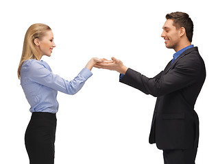 Image showing man and woman showing something on the palms