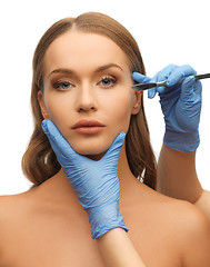 Image showing woman face and beautician hands