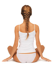 Image showing woman in undrewear practicing yoga lotus pose