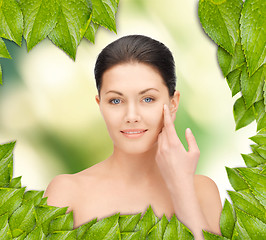 Image showing beautiful woman with green leaves