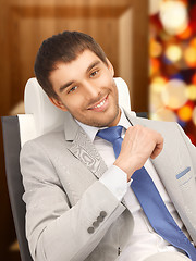 Image showing young businessman sitting in chair