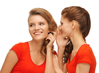 Image showing two talking teenage girls in red t-shirts