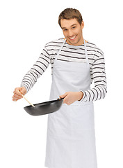 Image showing handsome man with pan and spoon