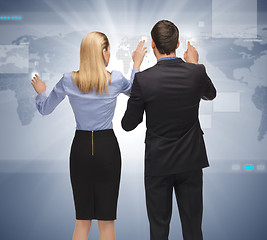 Image showing man and woman working with something imaginary