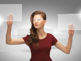 Image showing teenage girl working with virtual screen