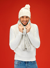 Image showing handsome man in warm sweater, hat and scarf