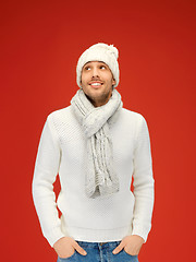 Image showing handsome man in warm sweater, hat and scarf