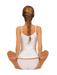 Image showing woman in undrewear practicing yoga lotus pose