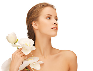 Image showing lovely woman with orchid flower