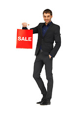 Image showing handsome man in suit with shopping bags