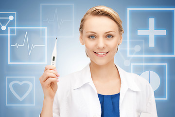 Image showing attractive female doctor with thermometer