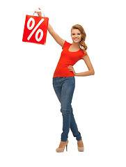 Image showing teenage girl in red t-shirt with shopping bag