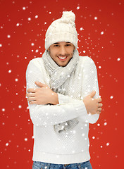 Image showing handsome man in warm sweater, hat and scarf