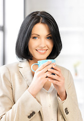 Image showing lovely businesswoman with mug