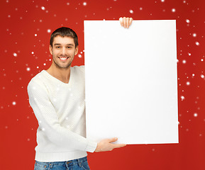 Image showing handsome man with big blank board