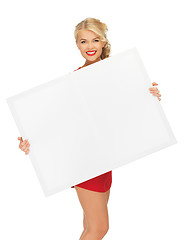 Image showing lovely woman in red dress with blank board