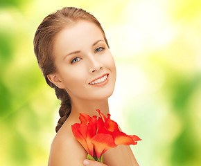 Image showing beautiful woman with red lily flower