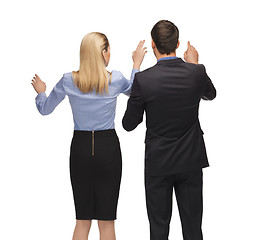 Image showing man and woman working with something imaginary