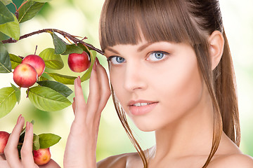 Image showing lovely woman with apple twig