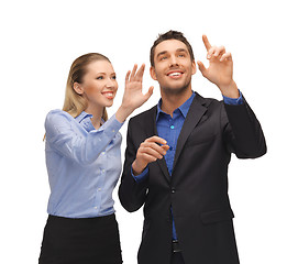 Image showing man and woman working with something imaginary
