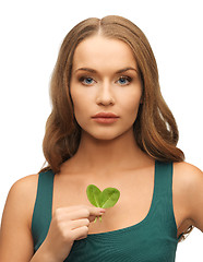 Image showing woman with spinach leaves on palms