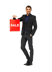 Image showing handsome man in suit with shopping bags