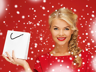 Image showing lovely woman in red dress with shopping bag