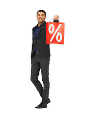 Image showing handsome man in suit with percent sign