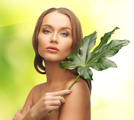 Image showing woman with green leaf