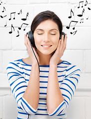 Image showing happy teenage girl in big headphones