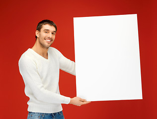 Image showing handsome man with big blank board