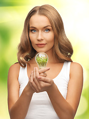 Image showing woman with energy saving bulb