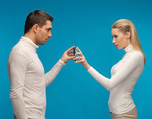 Image showing man and woman with modern gadgets