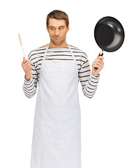 Image showing handsome man with pan and spoon