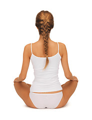 Image showing woman in undrewear practicing yoga lotus pose