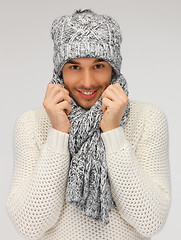 Image showing handsome man in warm sweater, hat and scarf