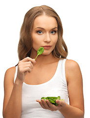 Image showing woman with spinach leaves on palms