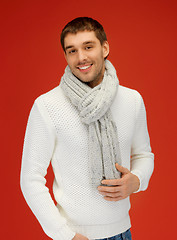 Image showing handsome man in warm sweater and scarf