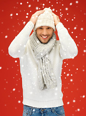 Image showing handsome man in warm sweater, hat and scarf