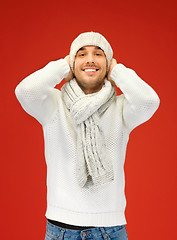 Image showing handsome man in warm sweater, hat and scarf