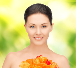 Image showing lovely woman with red flowers