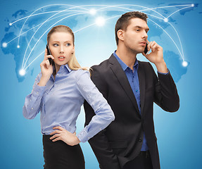 Image showing man and woman with cell phones