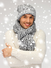 Image showing handsome man in warm sweater, hat and scarf