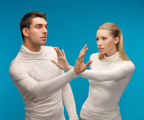 Image showing man and woman working with something imaginary