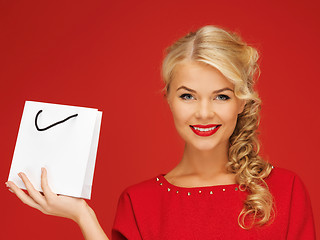 Image showing lovely woman in red dress with shopping bag