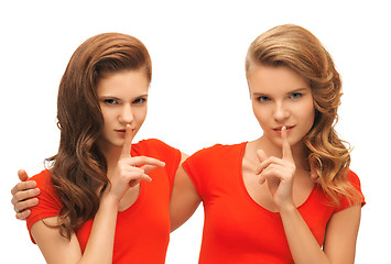 Image showing two teenage girls showing hush gesture